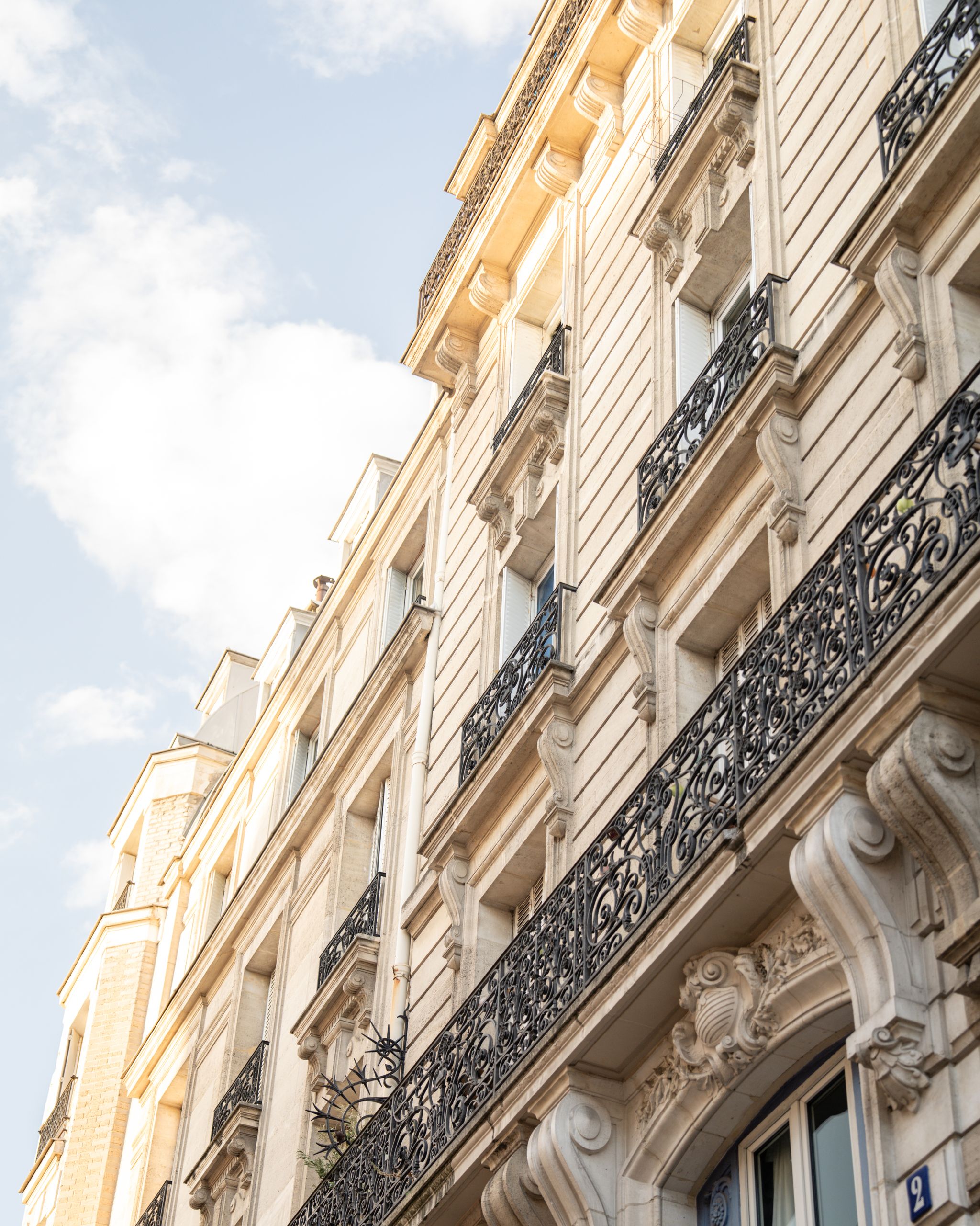 Charming Parisian architecture captured with ornate balconies and classic details.